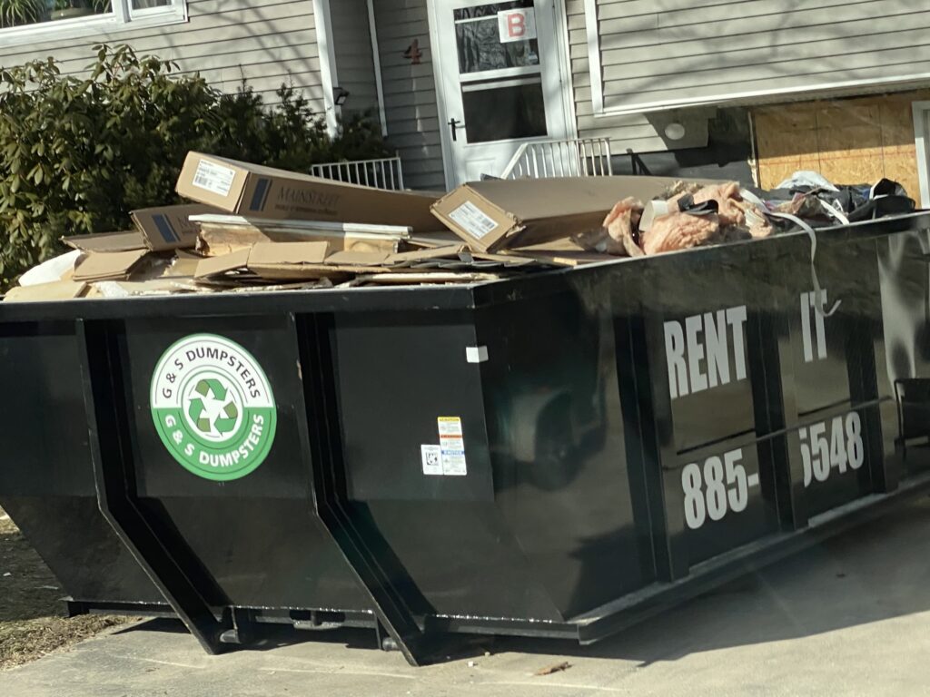 full dumpster ready for pickup