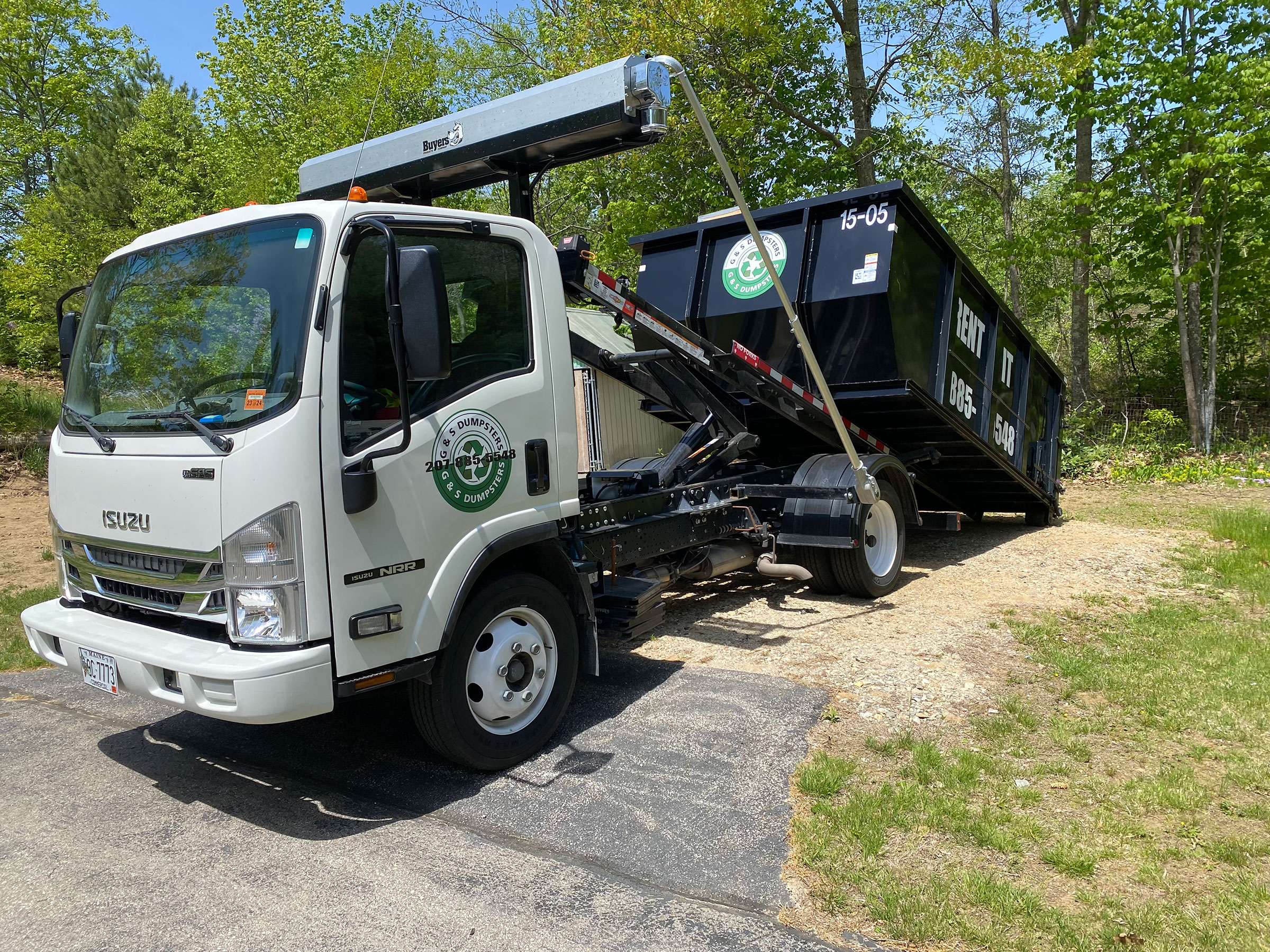 dumpster being picked up angle 2