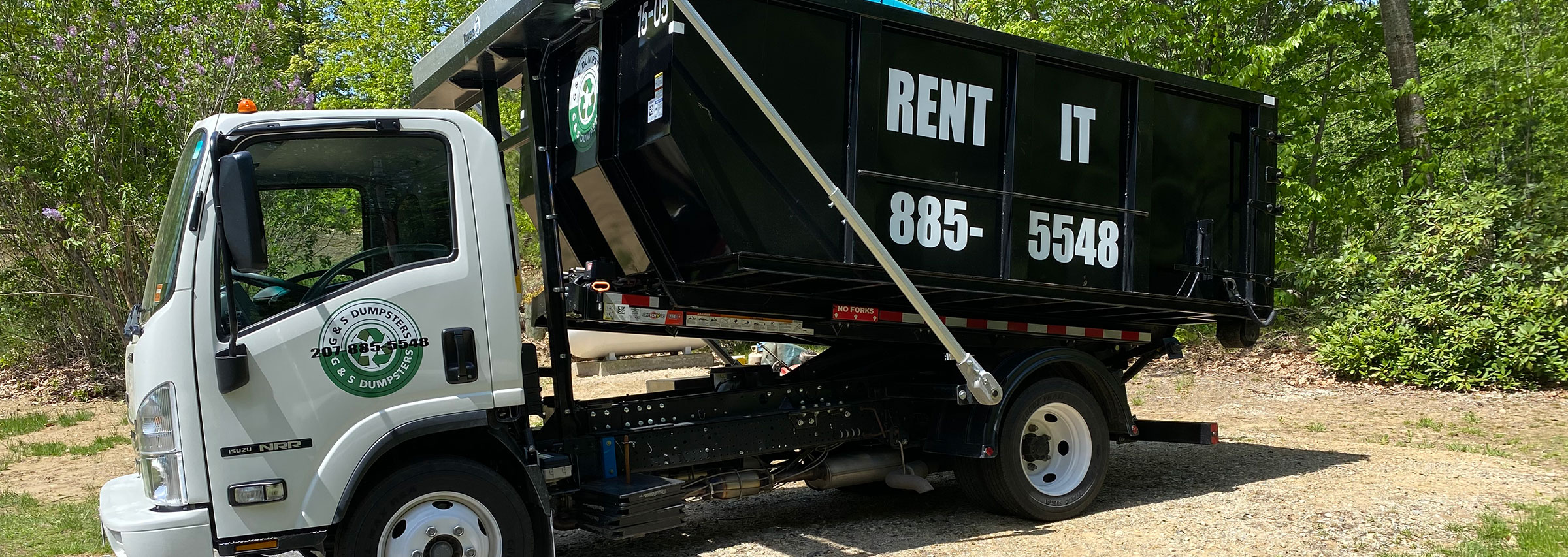 dumpster being picked up